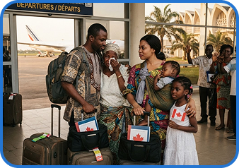 A family with luggage at an airport departures hall, one child holding a Canadian flag.